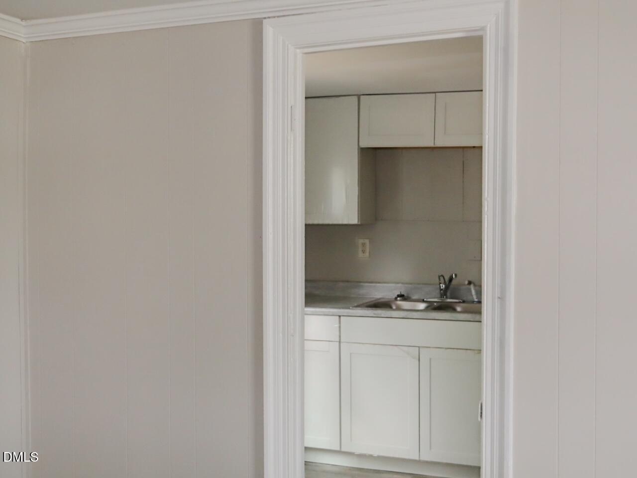 240 East Raleigh Boulevard Rocky Mount, NC 27801 - Photo 16 of 23 a kitchen with a sink and cabinets