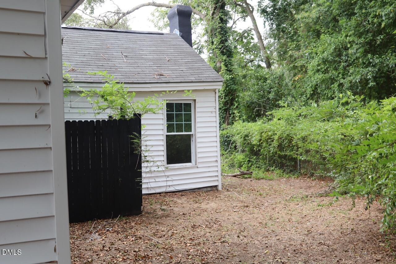 240 East Raleigh Boulevard Rocky Mount, NC 27801 - Photo 19 of 23 a view of a wooden door and a window of the house