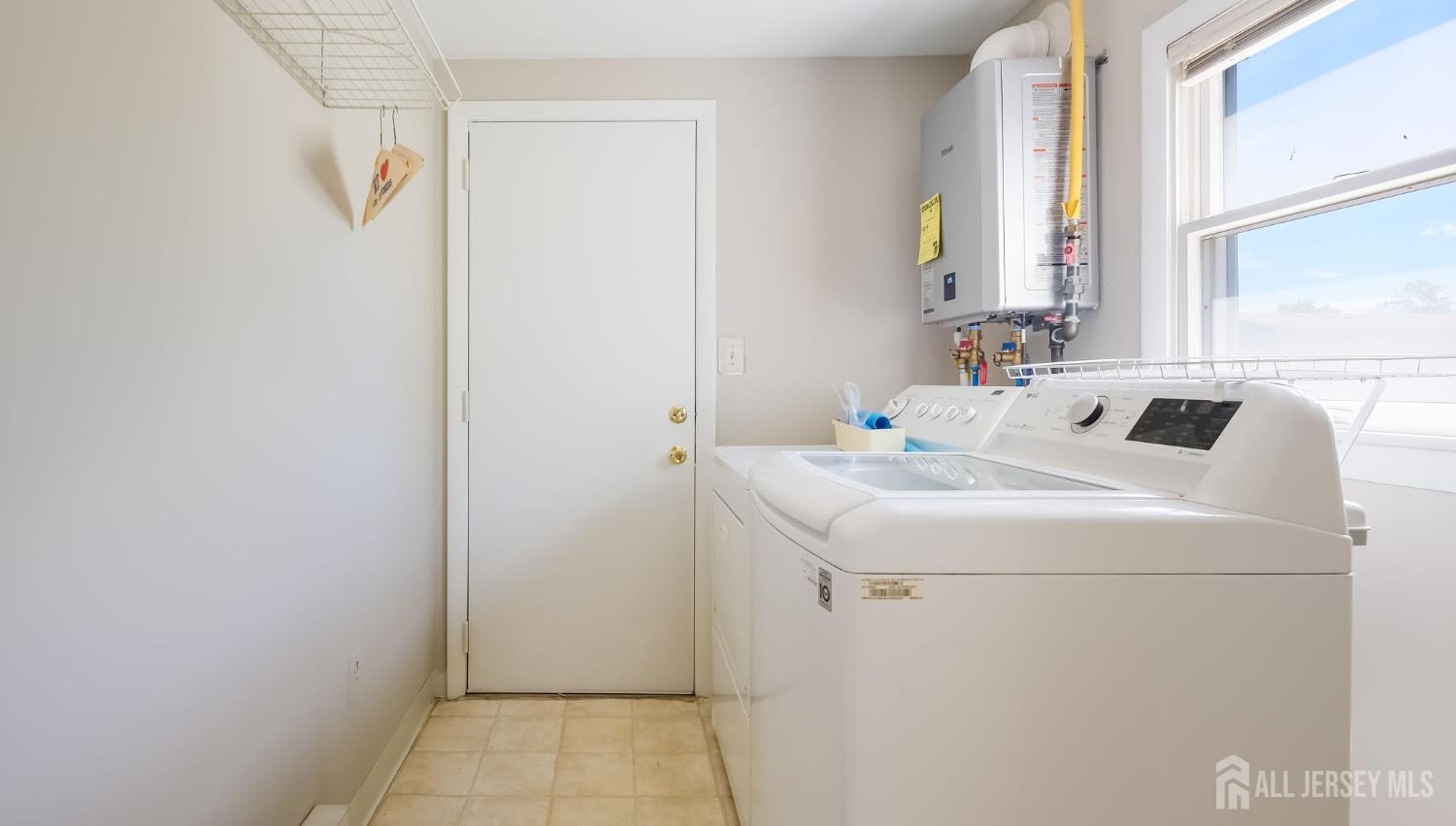 50 Sand Hills Road Kendall Park, NJ 08824 - Photo 13 of 27 a utility room with dryer and washer