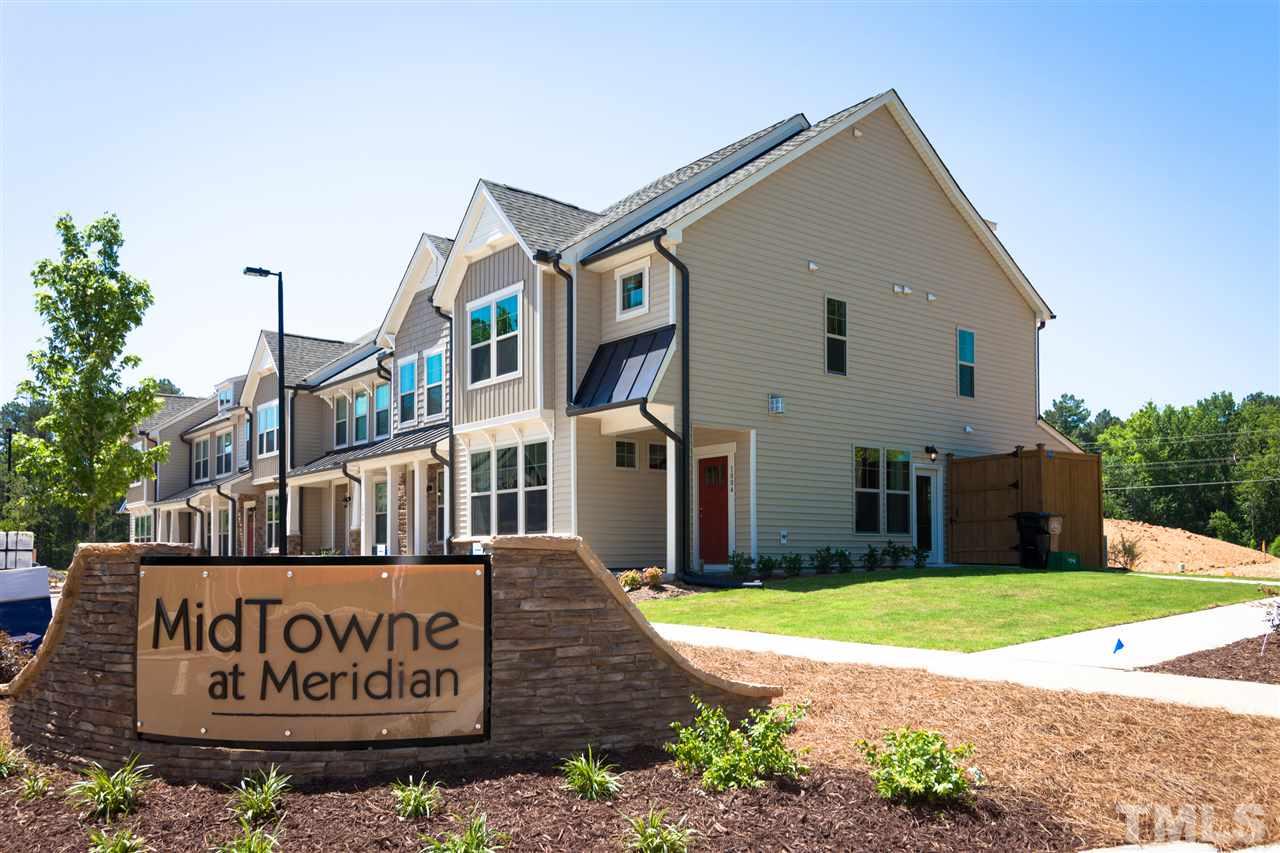1116 Midtowne Way Durham, NC 27713 - Photo 11 of 25 a front view of building with yard and sign board