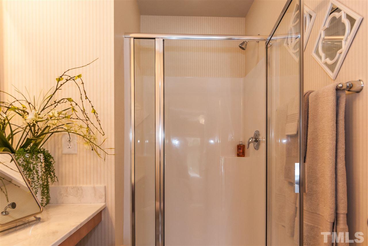 1116 Midtowne Way Durham, NC 27713 - Photo 17 of 25 a bathroom with a bathtub and shower