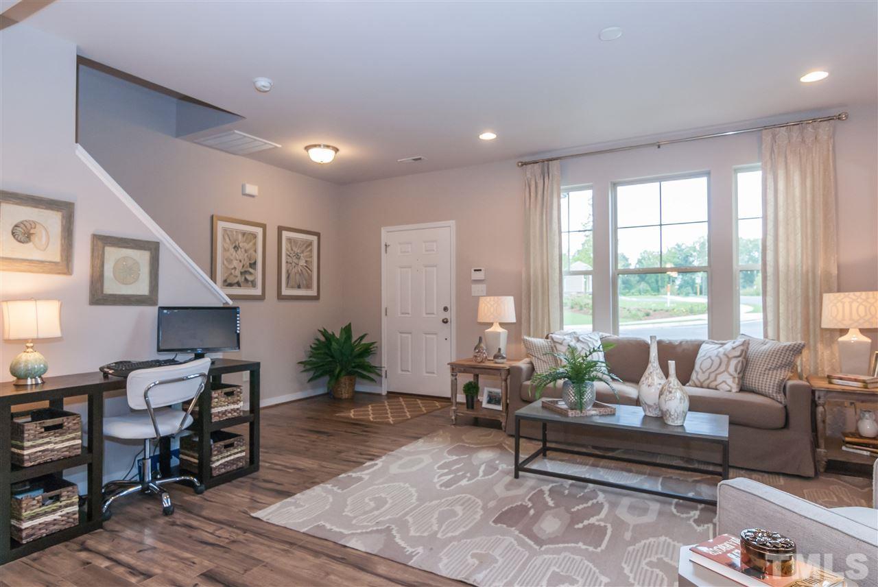 1116 Midtowne Way Durham, NC 27713 - Photo 21 of 25 a living room with furniture and a large window