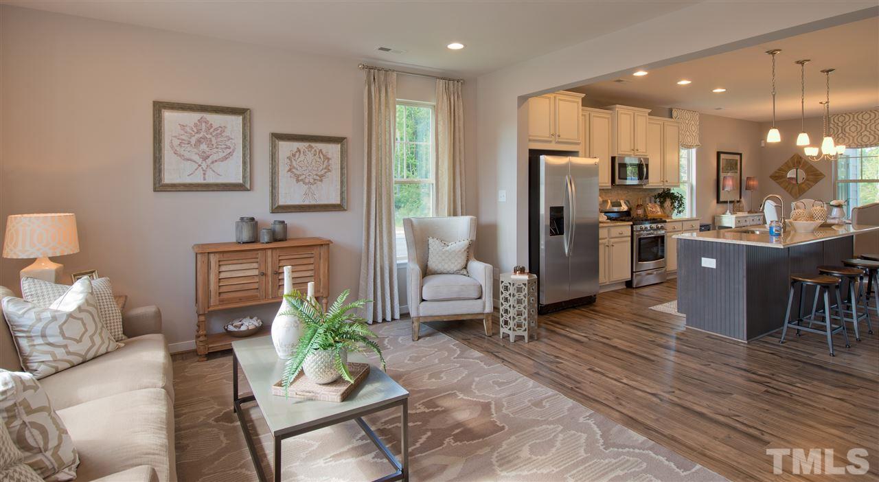 1116 Midtowne Way Durham, NC 27713 - Photo 8 of 25 a living room with furniture kitchen and a table