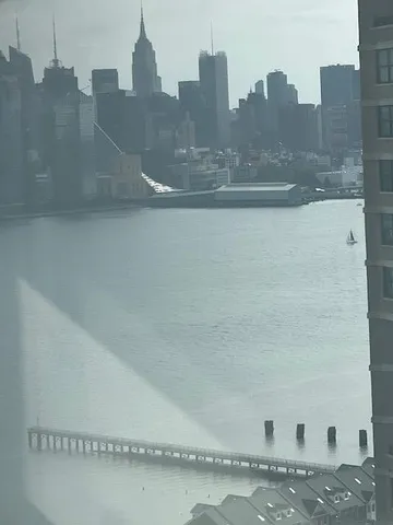 a bedroom with a bed and cabinets