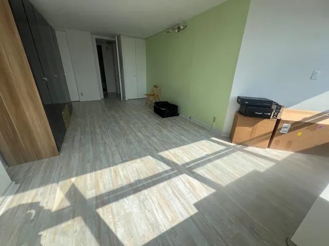 a view of an empty room with a window