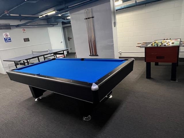 7004 Boulevard East, Unit 30G Guttenberg, NJ 07093 - Photo 33 of 34 a pool table sitting in the middle of a room