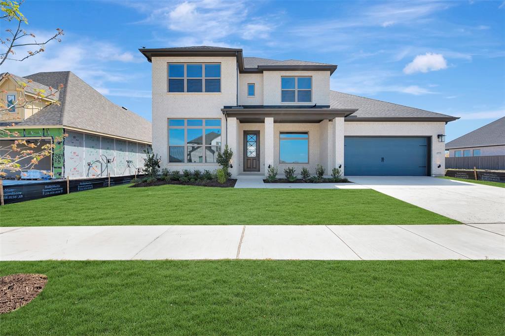 3575 Redbud Flower Trail Venus, TX 76084 - Photo 1 of 36 Prairie-style house featuring a front yard, a garage, stucco siding, and concrete driveway