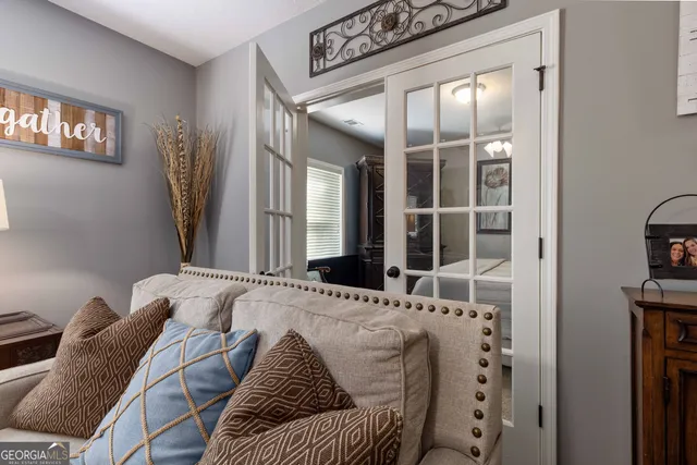 a bed sitting in a bedroom next to a window