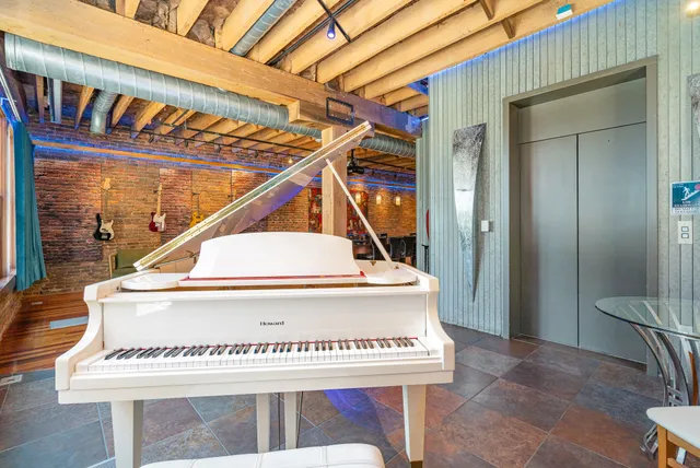 a view of a building with sitting area