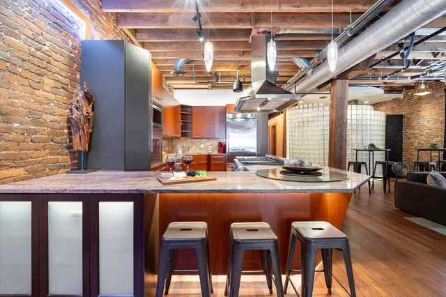 a dining table with chairs and wooden floor