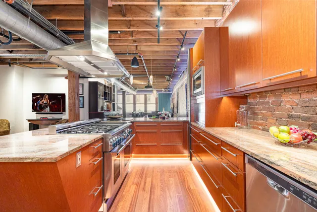 a view of a kitchen with granite countertop lots of counter top space