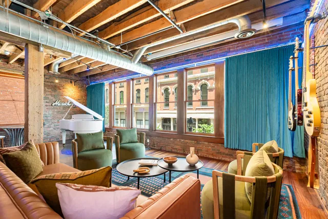 a living room with furniture and a window