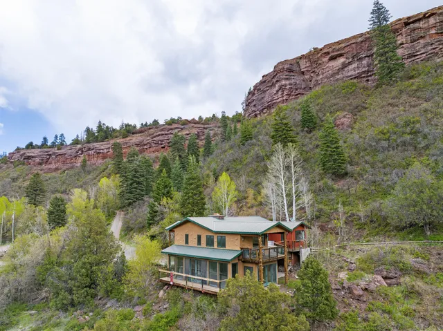 an aerial view of a house with a garden
