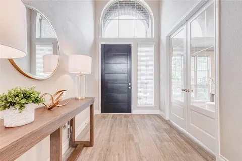 a bed room with a bed and a window
