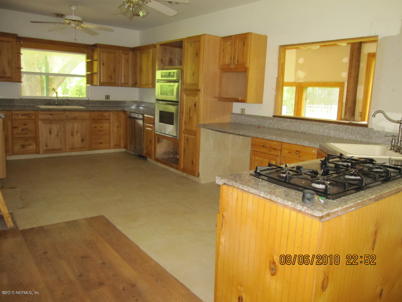 4185 Corbin Road St. Augustine, FL 32092 - Photo 3 of 12 a kitchen with stainless steel appliances a stove a sink and a refrigerator