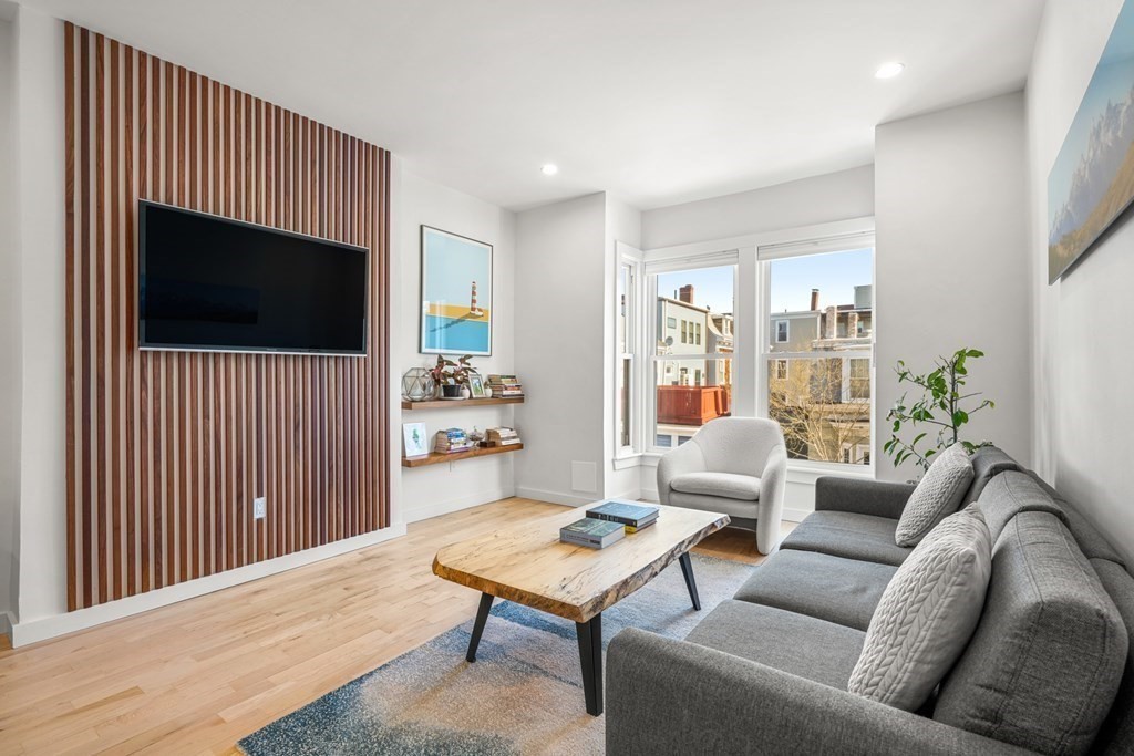 261 West Fifth Street, Unit 2 Boston, MA 02127 - Photo 13 of 31 a living room with furniture and a flat screen tv