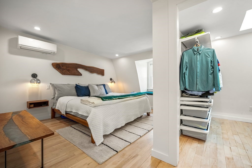 261 West Fifth Street, Unit 2 Boston, MA 02127 - Photo 18 of 31 a bedroom with a bed and a chair