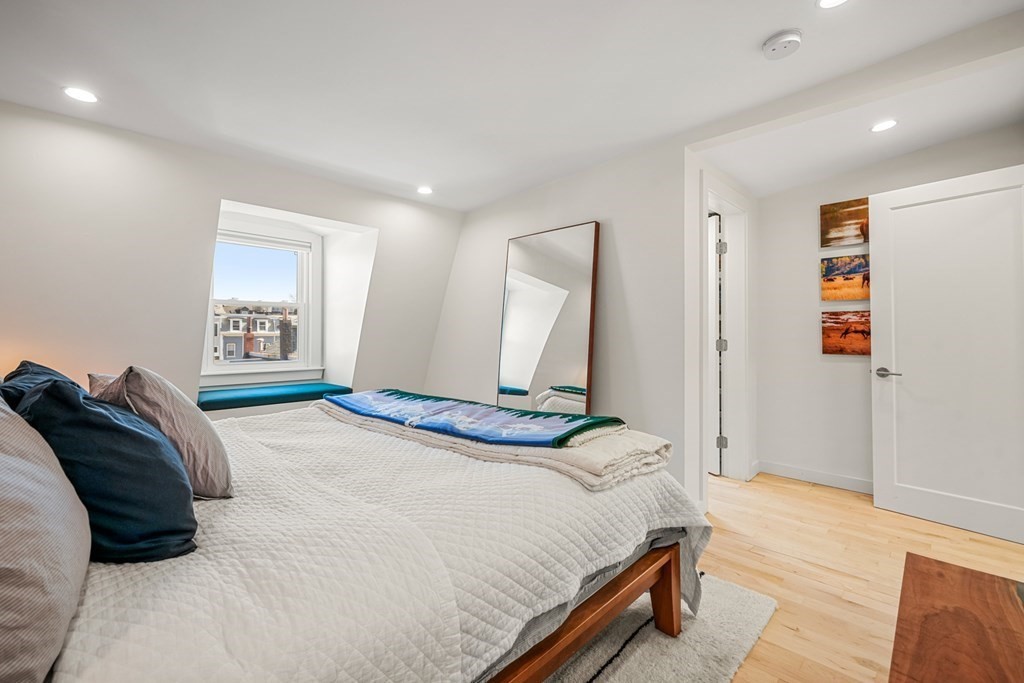 261 West Fifth Street, Unit 2 Boston, MA 02127 - Photo 20 of 31 a bedroom with a bed and a large window