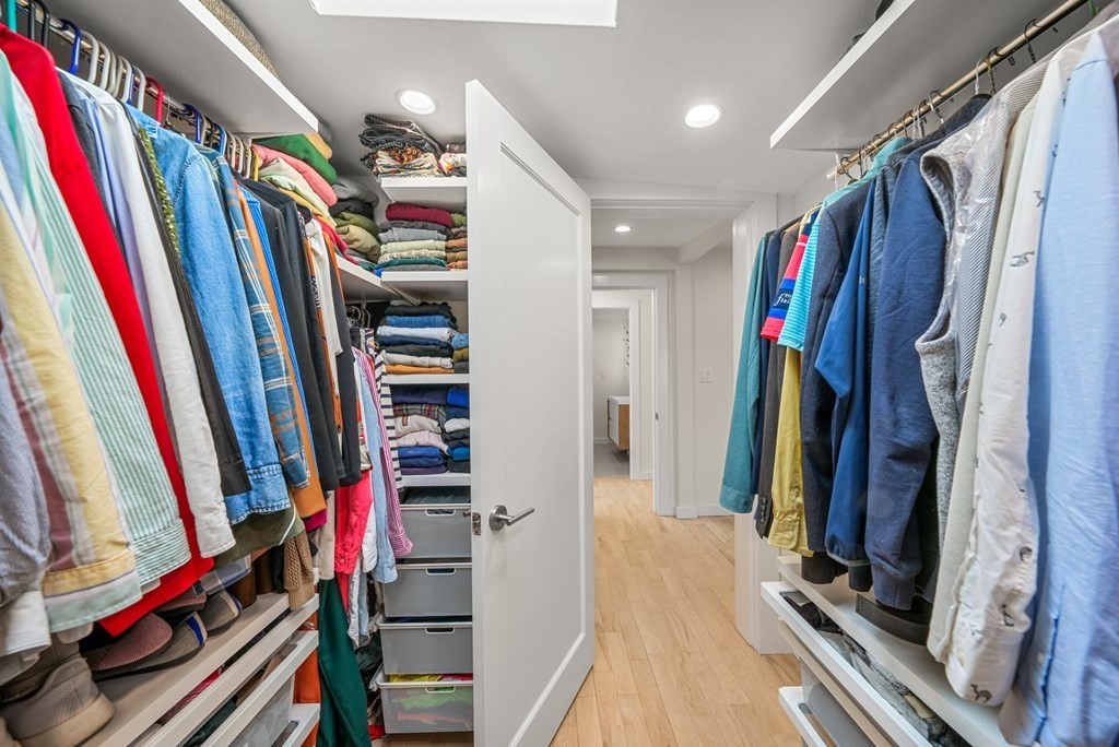 261 West Fifth Street, Unit 2 Boston, MA 02127 - Photo 21 of 31 a view of walk in closet with clothes and shoes