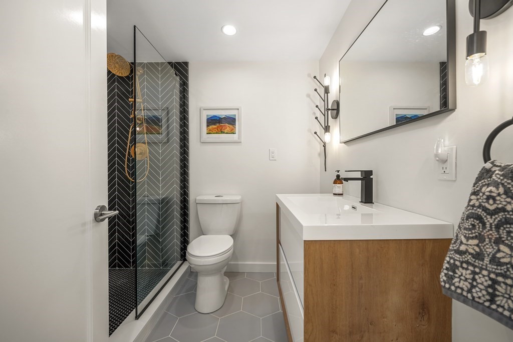 261 West Fifth Street, Unit 2 Boston, MA 02127 - Photo 22 of 31 a bathroom with a sink toilet and shower