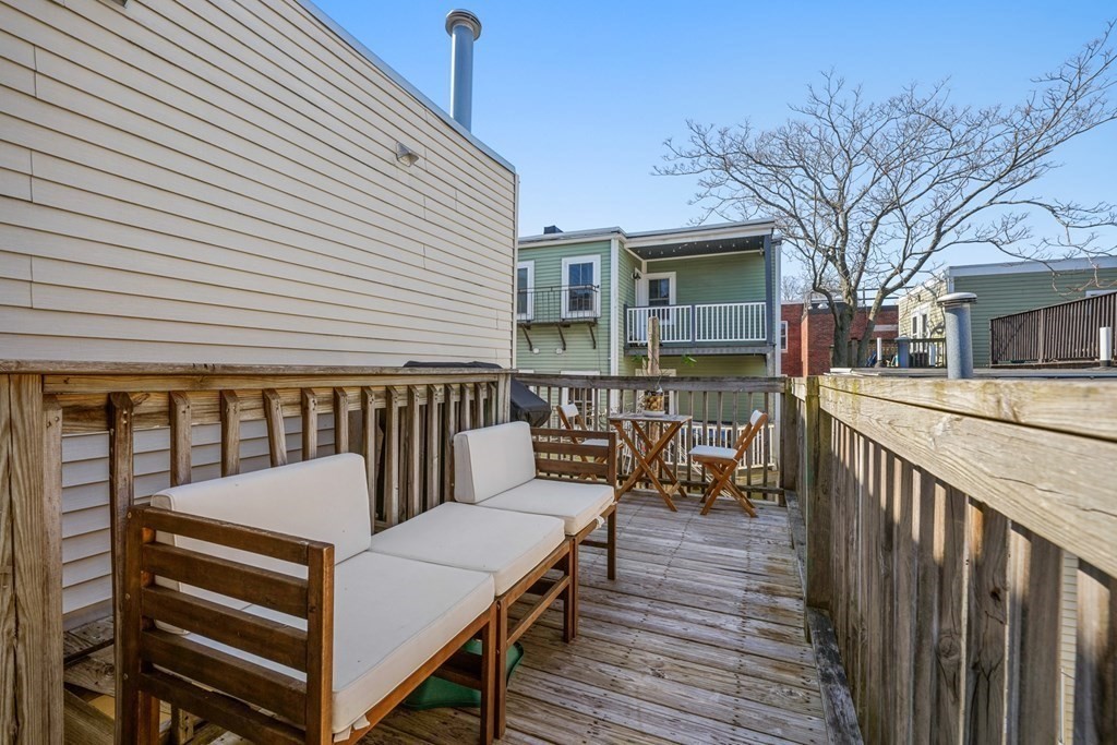 261 West Fifth Street, Unit 2 Boston, MA 02127 - Photo 28 of 31 a view of a roof deck with wooden floor and fence
