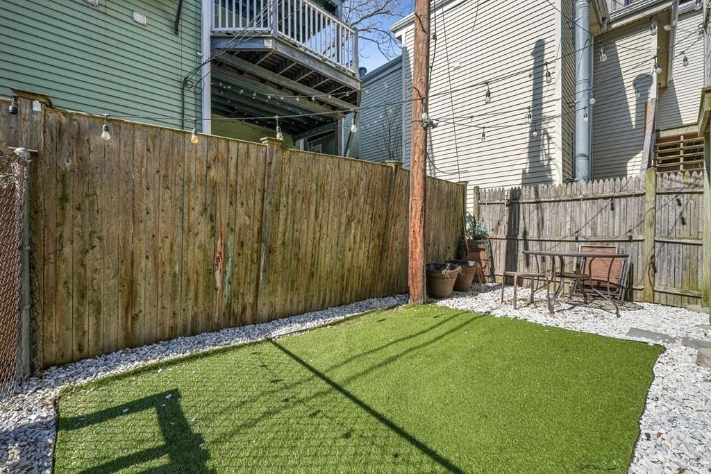 261 West Fifth Street, Unit 2 Boston, MA 02127 - Photo 30 of 31 a view of a backyard with a patio