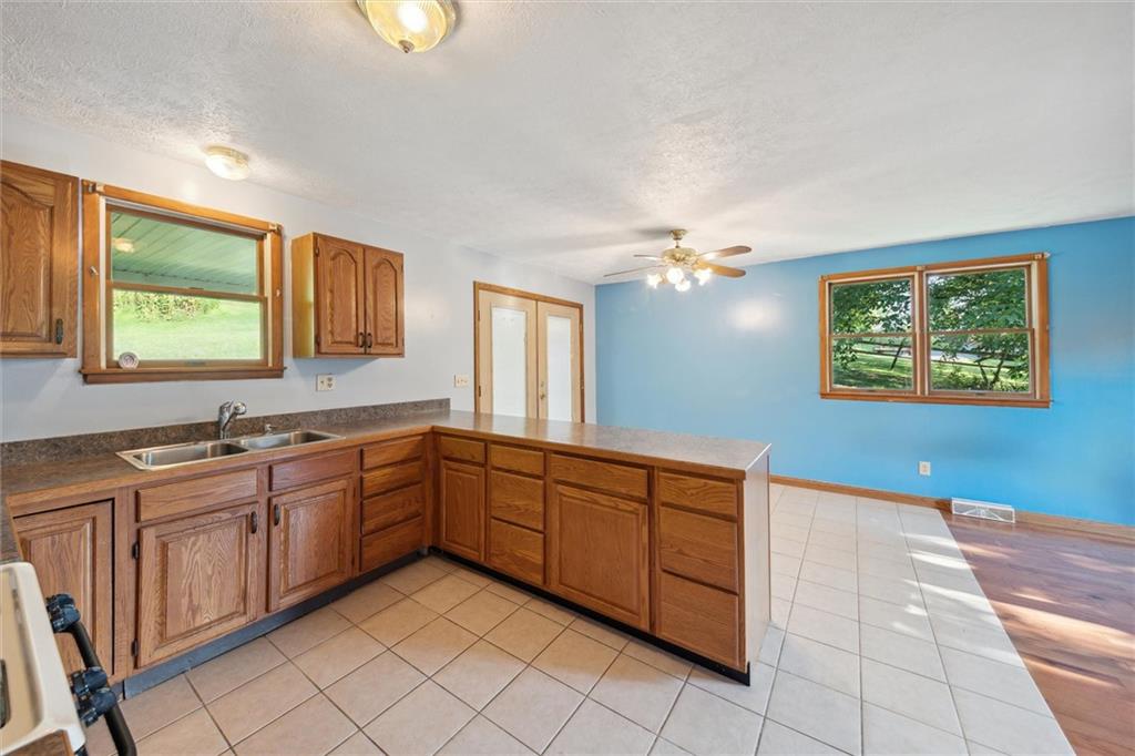 826 Pony Farm Road Kittanning, PA 16201 - Photo 13 of 35 a kitchen with a sink and cabinets