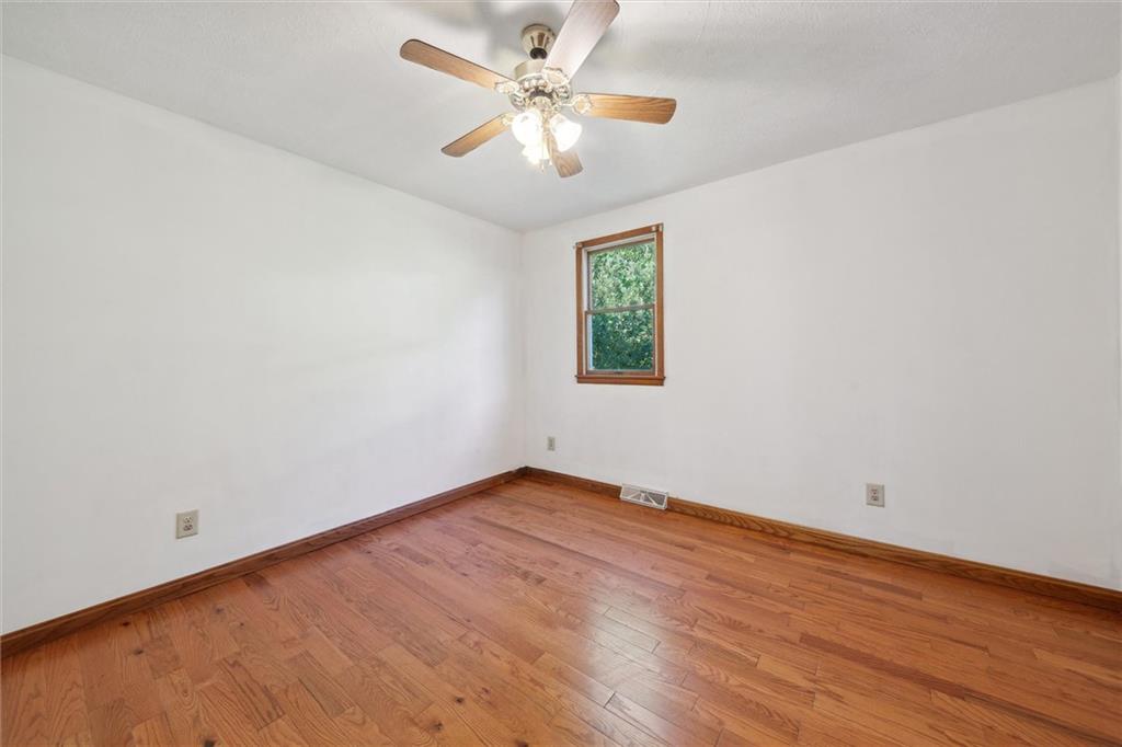 826 Pony Farm Road Kittanning, PA 16201 - Photo 18 of 35 an empty room with a window and a fan