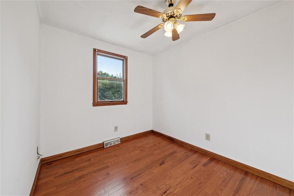826 Pony Farm Road Kittanning, PA 16201 - Photo 19 of 35 an empty room with a window and a fan