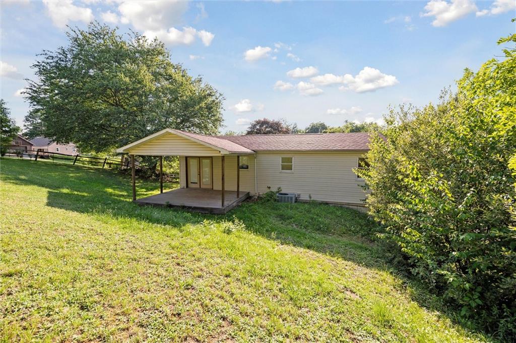 826 Pony Farm Road Kittanning, PA 16201 - Photo 30 of 35 a backyard of a house with yard and outdoor seating