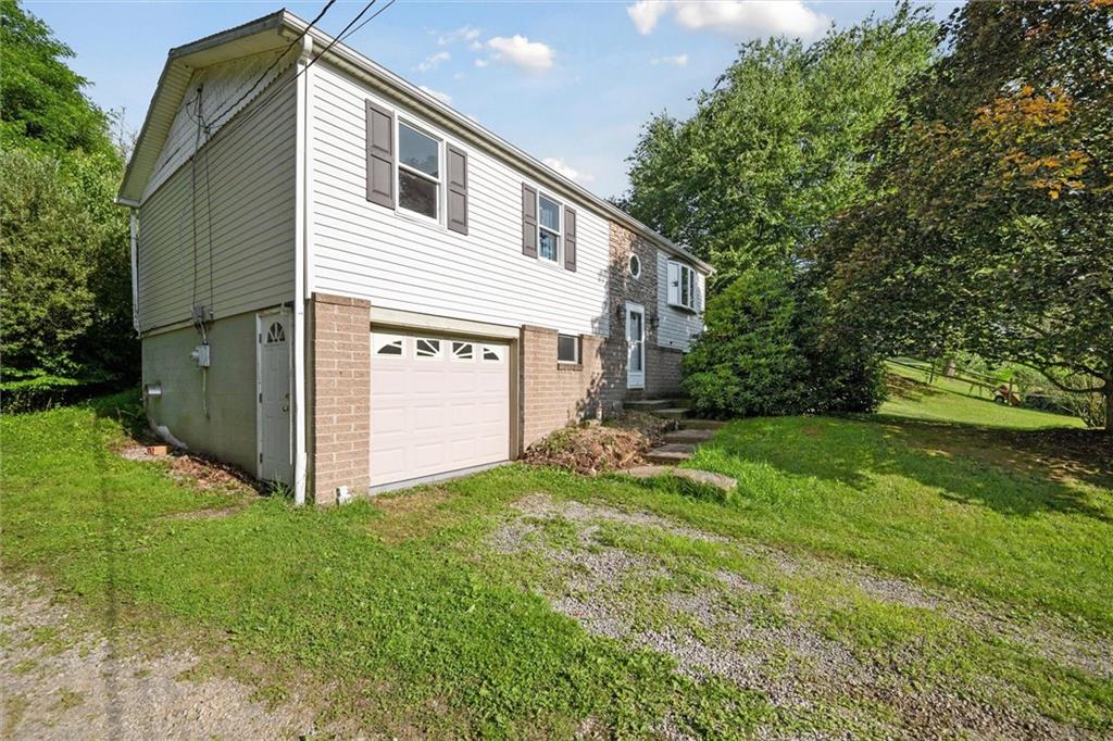 826 Pony Farm Road Kittanning, PA 16201 - Photo 3 of 35 a view of a house with backyard and garden