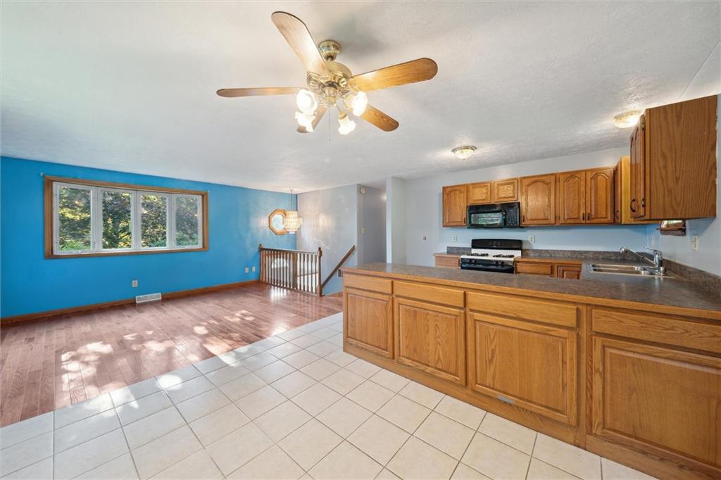826 Pony Farm Road Kittanning, PA 16201 - Photo 7 of 35 a kitchen with stainless steel appliances granite countertop a sink cabinets and window
