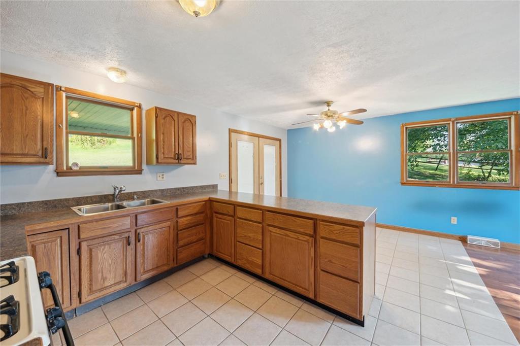 826 Pony Farm Road Kittanning, PA 16201 - Photo 9 of 35 a kitchen with a sink and cabinets