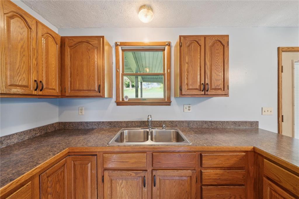 826 Pony Farm Road Kittanning, PA 16201 - Photo 10 of 35 a kitchen with a sink cabinets and window