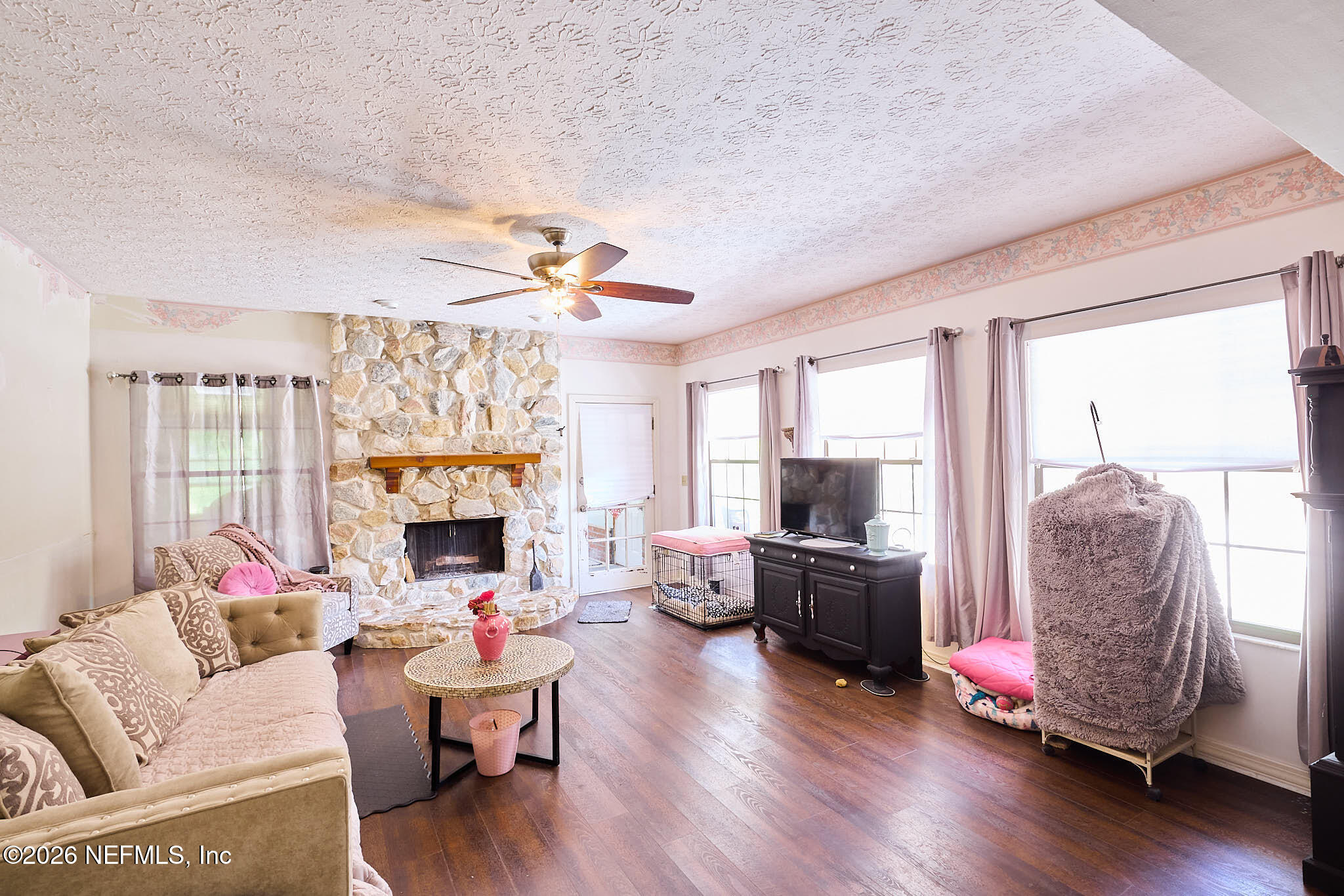 8965 San Rae Road Jacksonville, FL 32257 - Photo 21 of 46 a living room with furniture and a fireplace