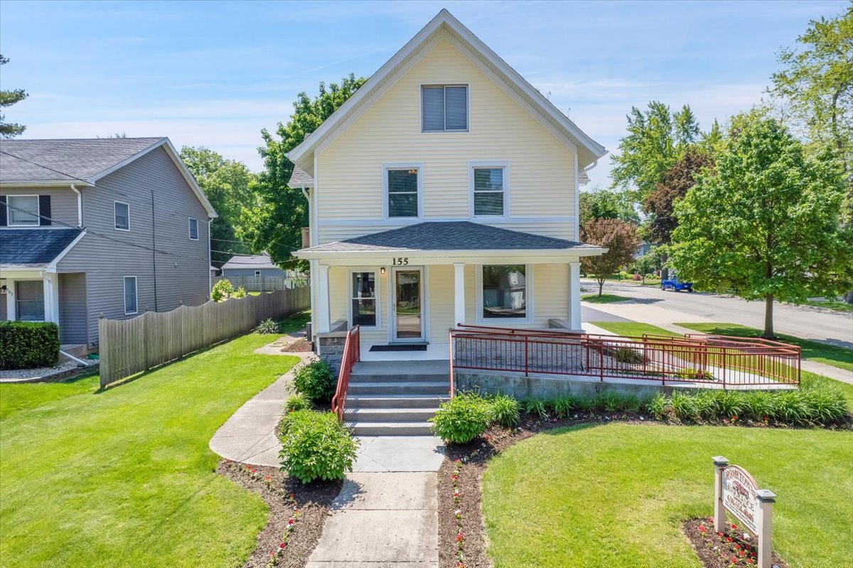155 Chicago Road Oswego, IL 60543 - Photo 1 of 50 a front view of a house with a yard table and chairs