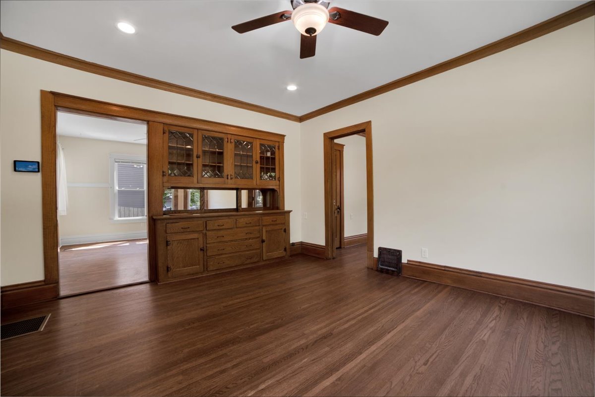 155 Chicago Road Oswego, IL 60543 - Photo 15 of 50 an empty room with wooden floor and windows