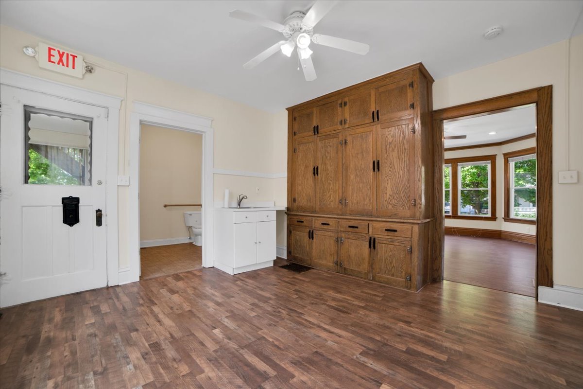 155 Chicago Road Oswego, IL 60543 - Photo 20 of 50 a view of empty room with wooden floor and cabinet
