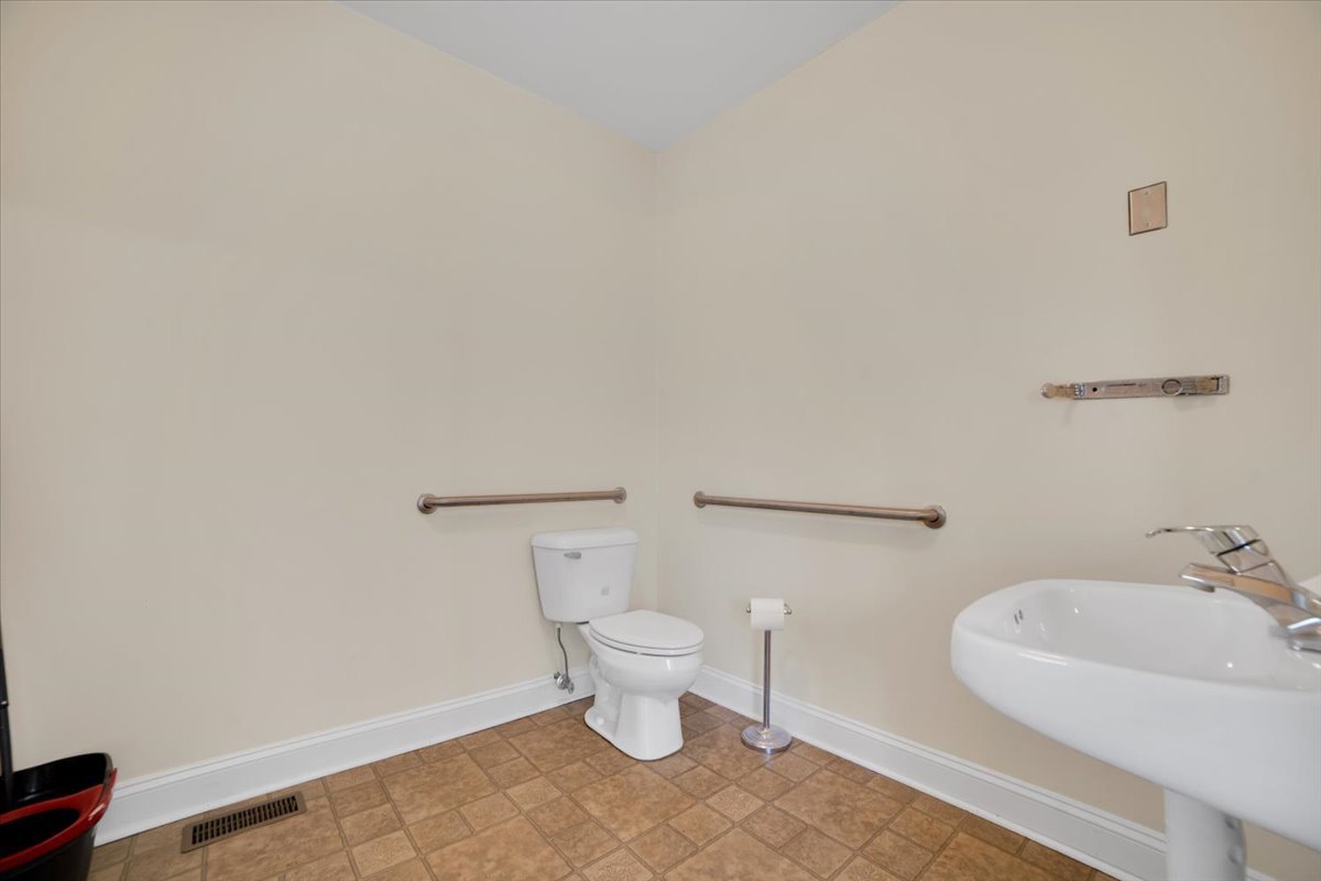 155 Chicago Road Oswego, IL 60543 - Photo 21 of 50 a bathroom with a toilet and a sink