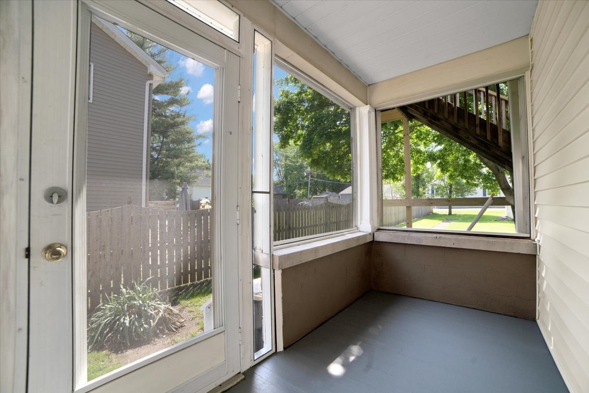 155 Chicago Road Oswego, IL 60543 - Photo 22 of 50 a view of an empty room with wooden floor and a window