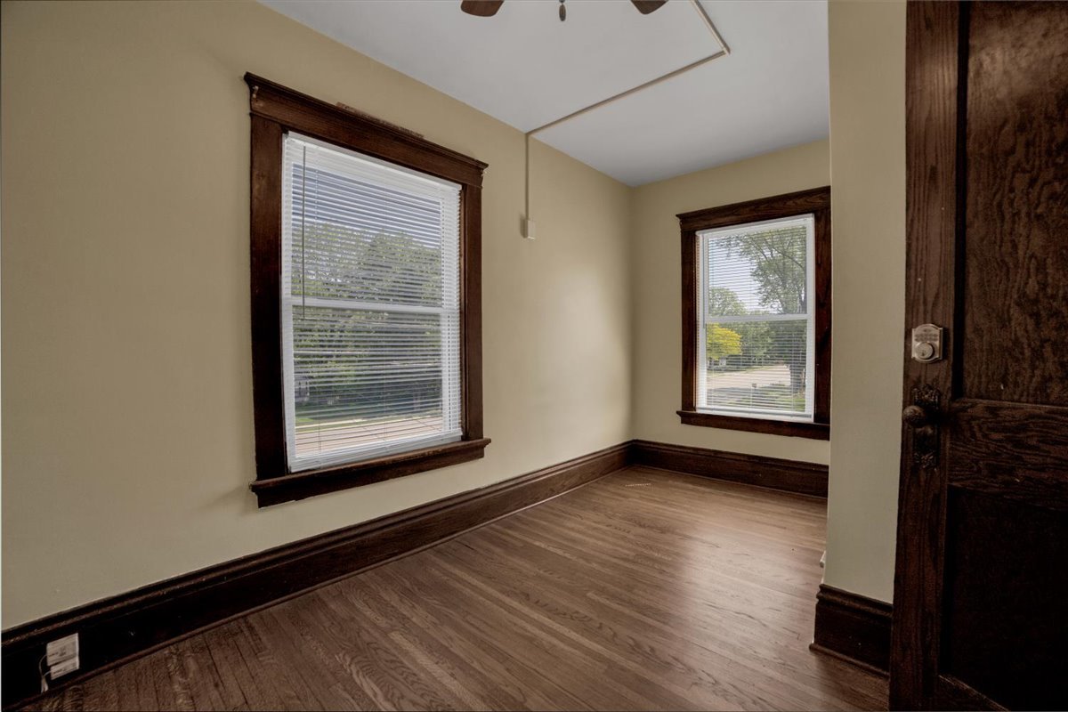 155 Chicago Road Oswego, IL 60543 - Photo 26 of 50 a view of an empty room with wooden floor and a window