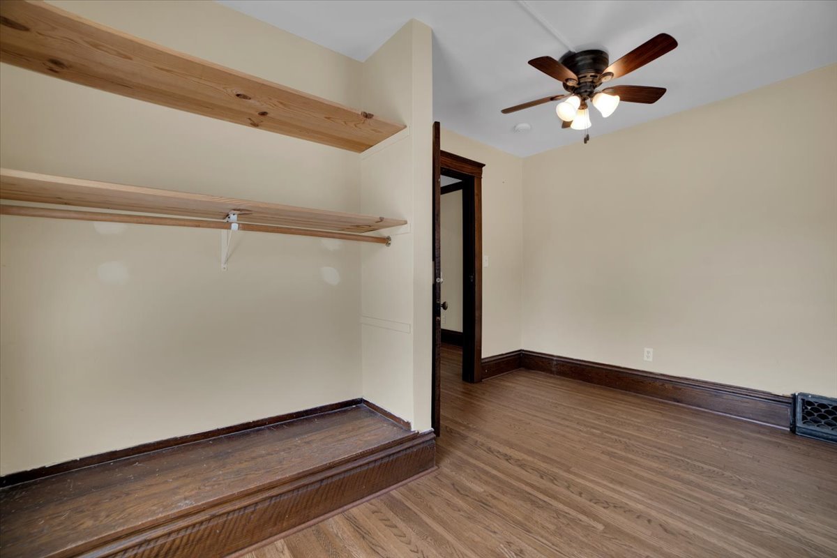 155 Chicago Road Oswego, IL 60543 - Photo 27 of 50 a view of an empty room with wooden floor