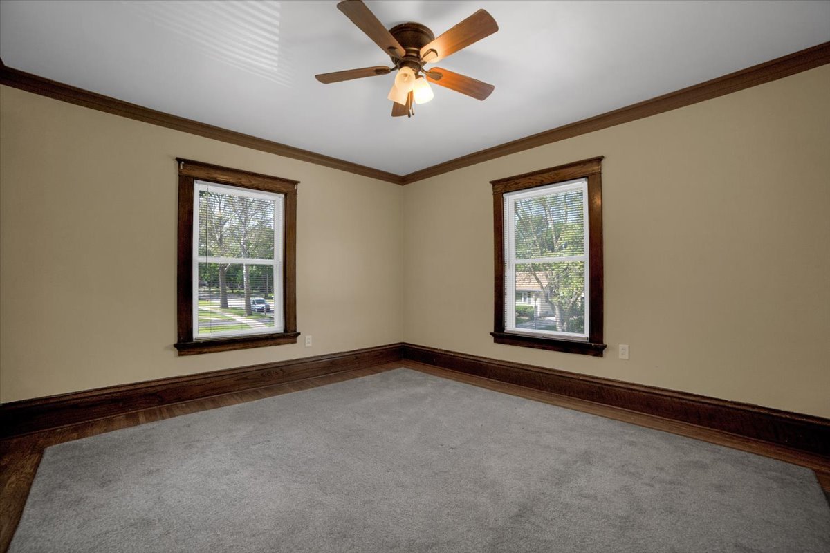 155 Chicago Road Oswego, IL 60543 - Photo 30 of 50 an empty room with windows and fan