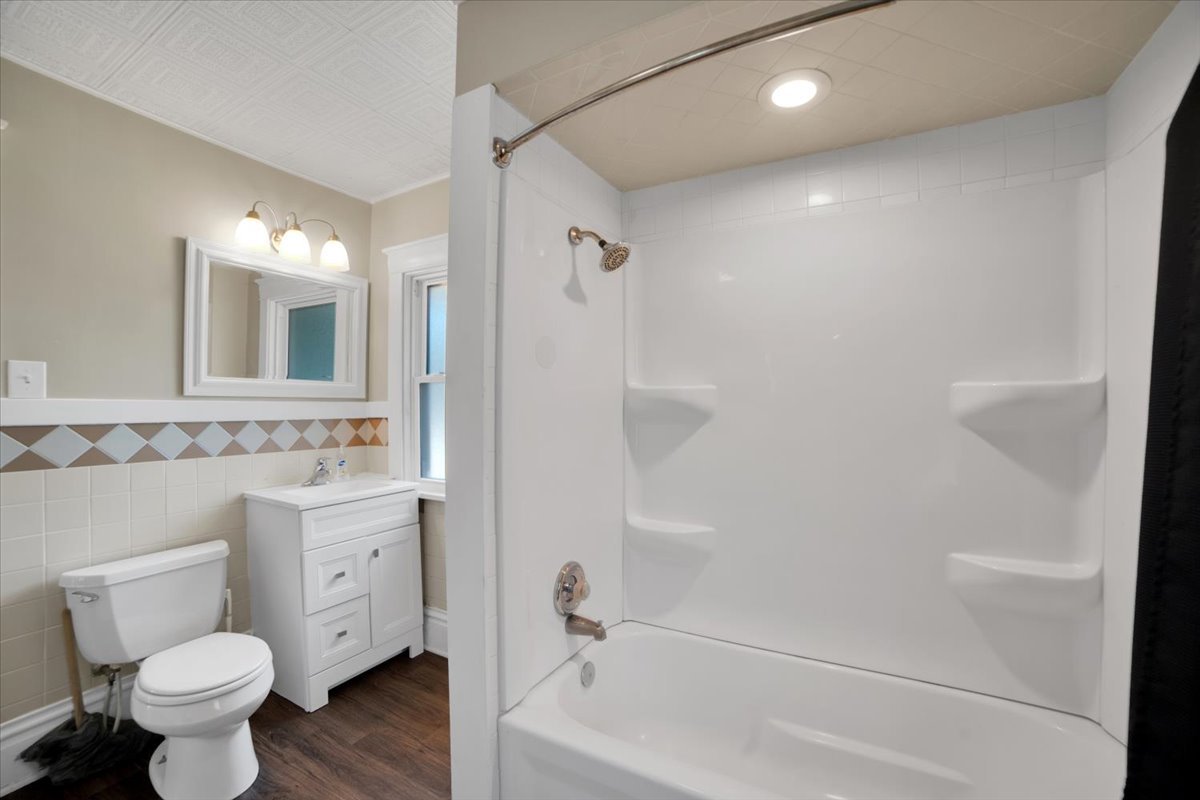 155 Chicago Road Oswego, IL 60543 - Photo 32 of 50 a bathroom with a sink toilet and shower