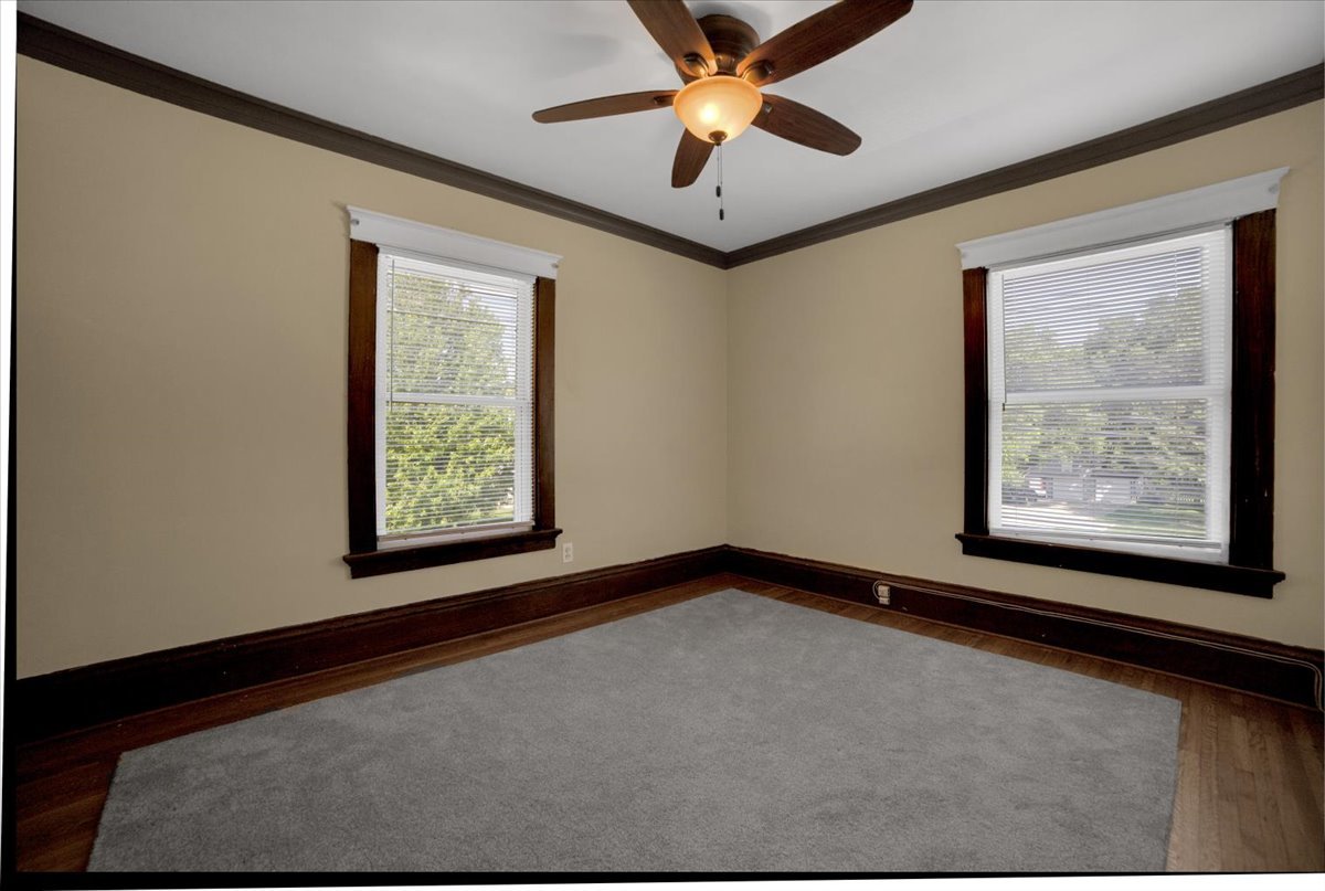 155 Chicago Road Oswego, IL 60543 - Photo 34 of 50 a view of a big room with windows and chandelier fan