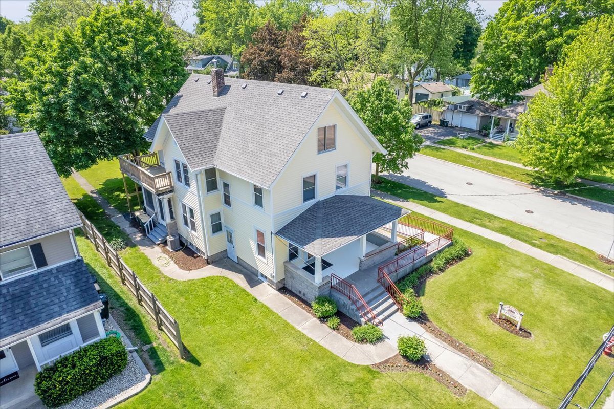 155 Chicago Road Oswego, IL 60543 - Photo 4 of 50 an aerial view of a house with swimming pool and large trees