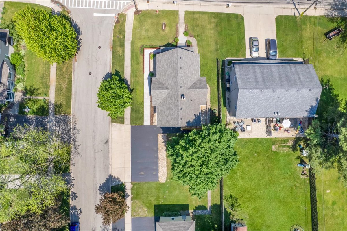 155 Chicago Road Oswego, IL 60543 - Photo 5 of 50 an aerial view of a house with a yard swimming pool and outdoor seating