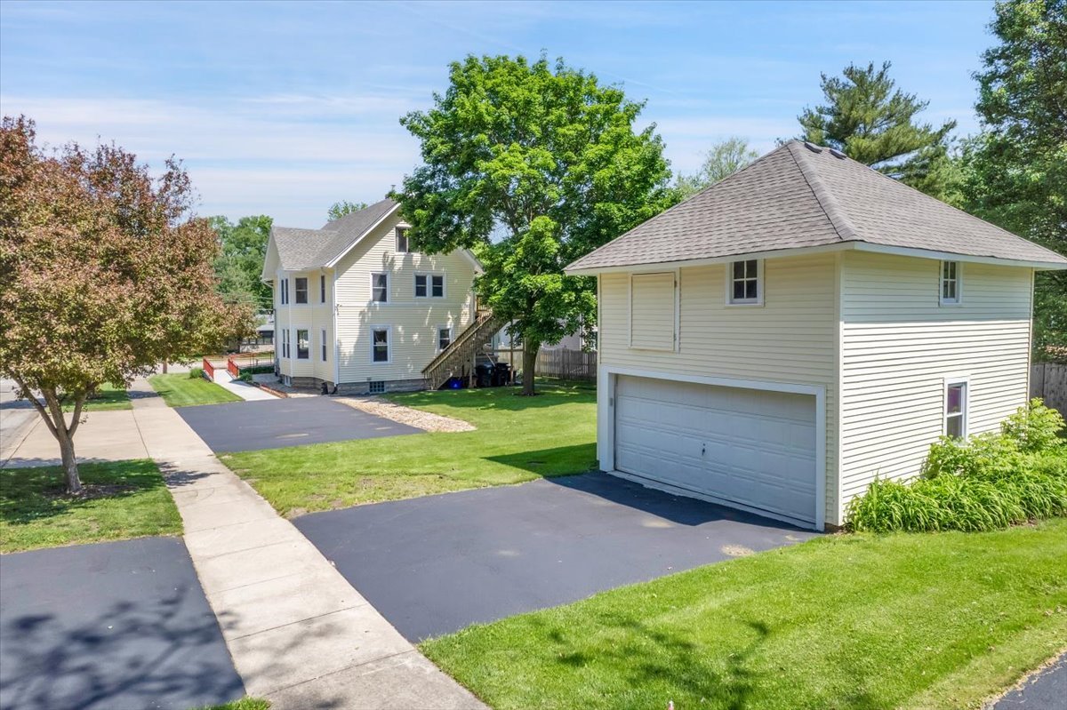155 Chicago Road Oswego, IL 60543 - Photo 6 of 50 a view of a house with a yard and large tree