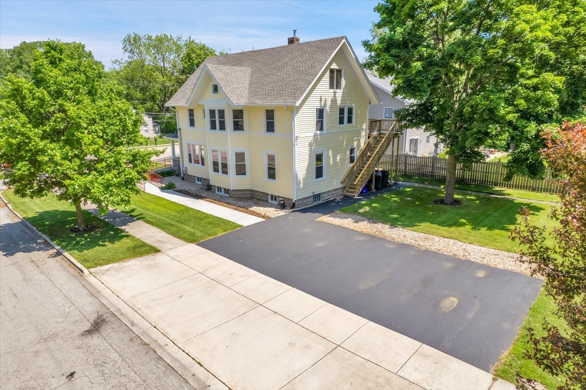 155 Chicago Road Oswego, IL 60543 - Photo 8 of 50 a view of house with a yard and potted plants