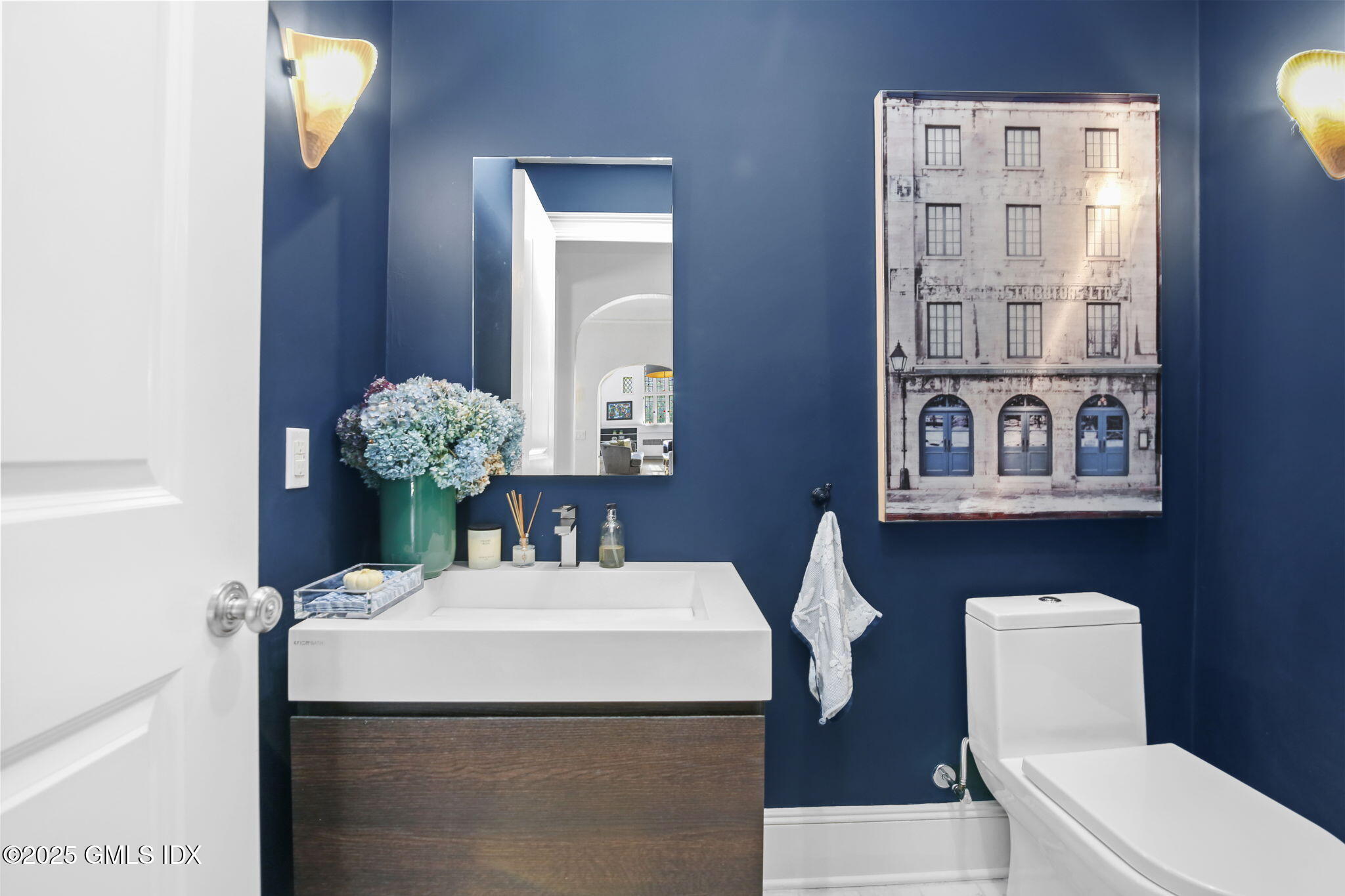 7 Stanwich Road Greenwich, CT 06830 - Photo 14 of 38 a bathroom with a toilet sink and mirror